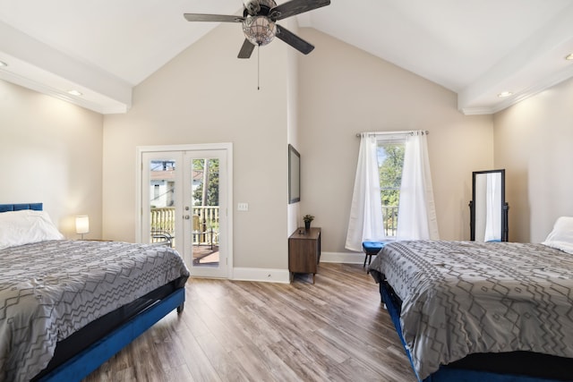 bedroom featuring multiple windows, ceiling fan, hardwood / wood-style floors, and french doors