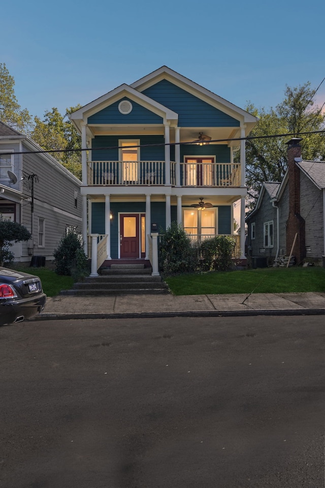 greek revival inspired property featuring a balcony