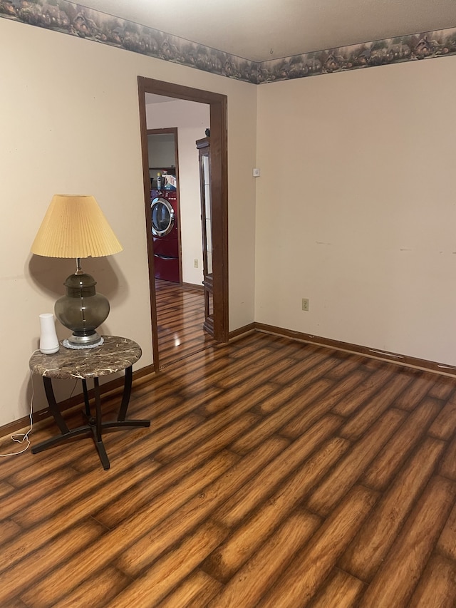 unfurnished room featuring dark hardwood / wood-style flooring