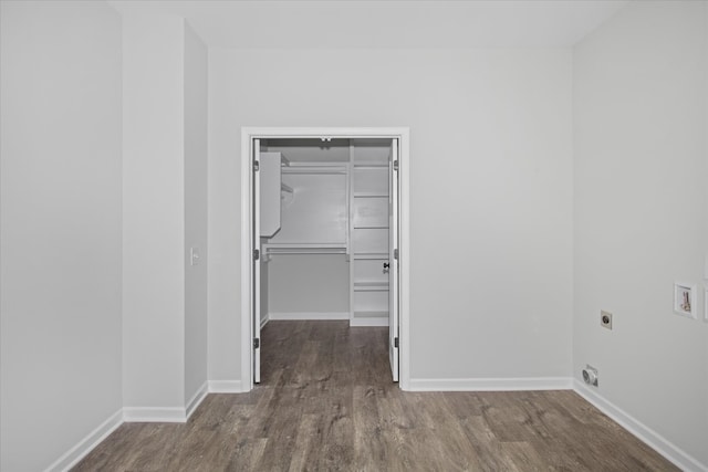 interior space with wood-type flooring, washer hookup, and electric dryer hookup