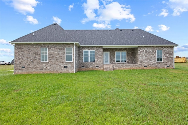 rear view of house with a lawn