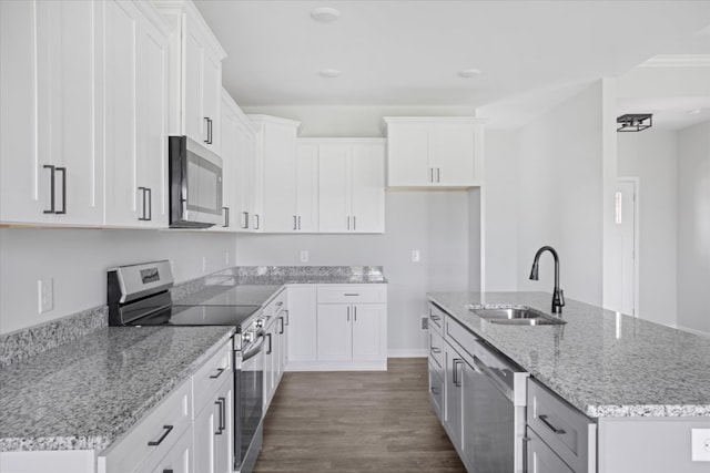 kitchen featuring white cabinets, stainless steel appliances, dark hardwood / wood-style floors, and sink