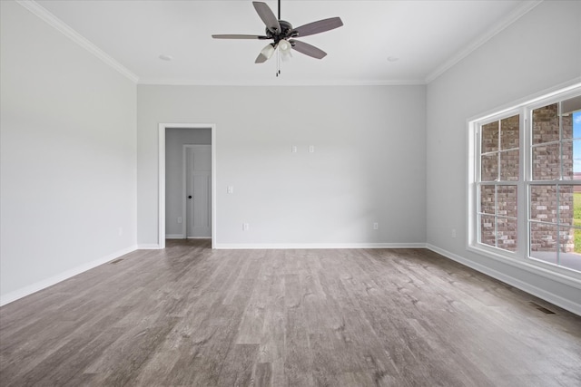 unfurnished room with ornamental molding, ceiling fan, and wood-type flooring