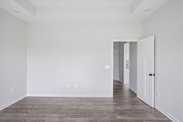 empty room featuring dark hardwood / wood-style floors