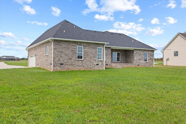 rear view of house featuring a yard