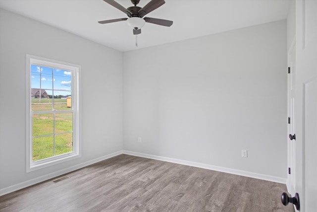 unfurnished room featuring light hardwood / wood-style floors and ceiling fan