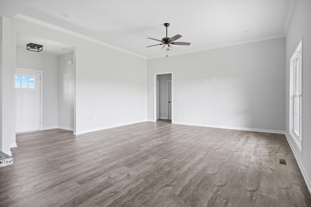 empty room with ornamental molding, ceiling fan, and dark hardwood / wood-style floors