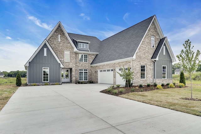 view of front of property with a garage and a front yard