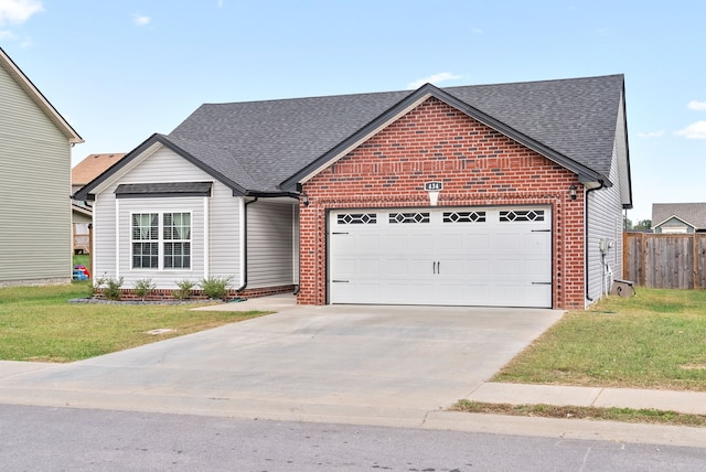 view of front facade featuring a front yard and a garage