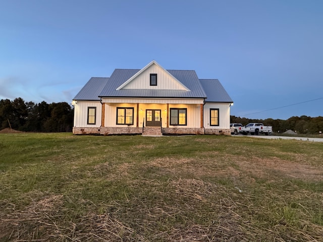 modern farmhouse with a front yard