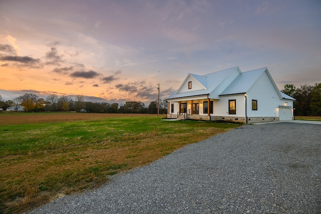 modern farmhouse featuring a yard and a porch