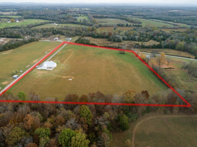 birds eye view of property featuring a rural view