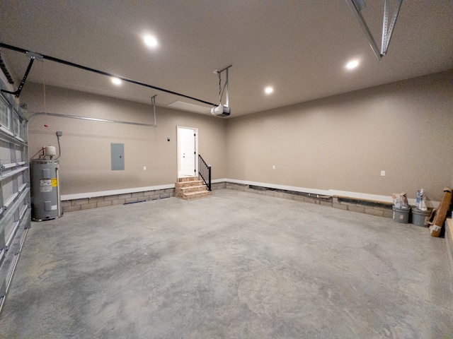 garage with a garage door opener and water heater