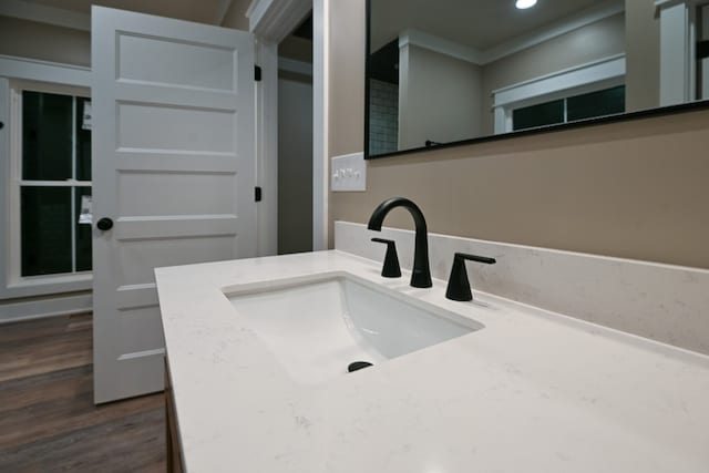 bathroom with vanity and hardwood / wood-style flooring