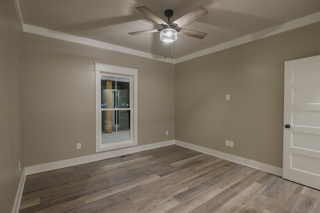 spare room with hardwood / wood-style floors and ceiling fan