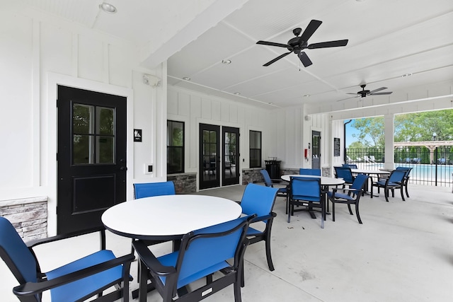 view of patio featuring a fenced in pool and ceiling fan