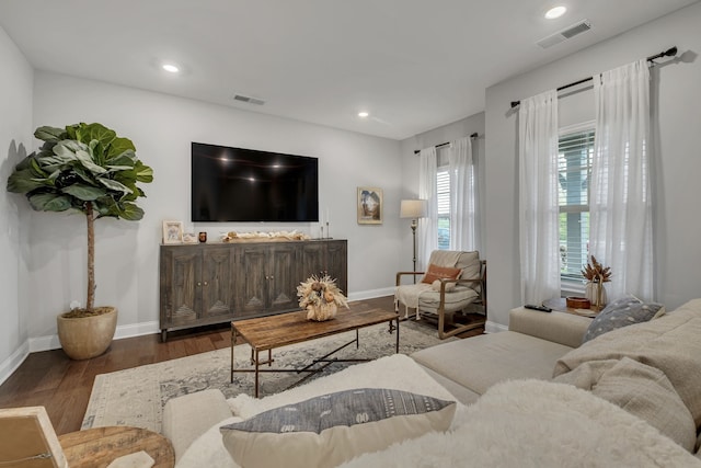 living room with dark hardwood / wood-style floors