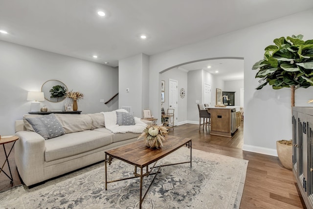 living room with light hardwood / wood-style flooring