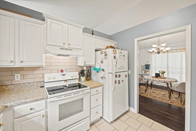 kitchen featuring white cabinets, a chandelier, light hardwood / wood-style floors, and white appliances