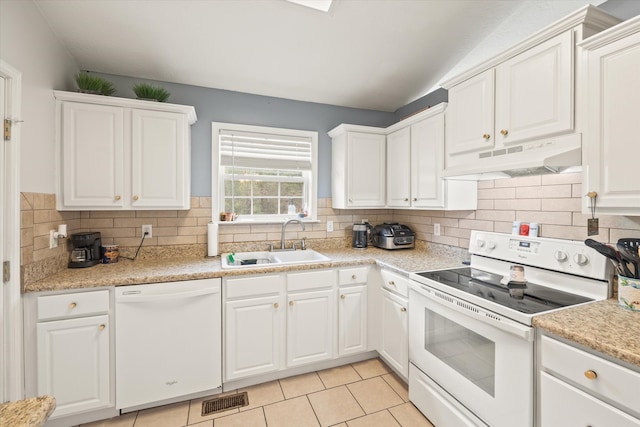 kitchen featuring decorative backsplash, sink, white appliances, and white cabinetry