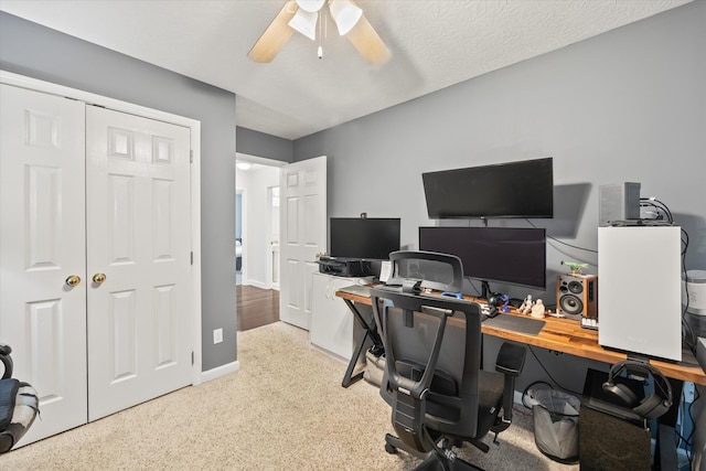 office featuring ceiling fan and a textured ceiling