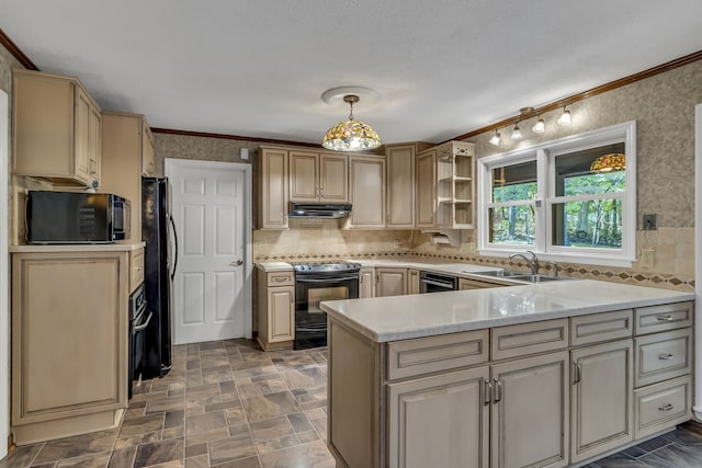 kitchen featuring pendant lighting, crown molding, kitchen peninsula, and black appliances