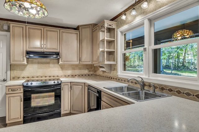 kitchen with black appliances, decorative light fixtures, sink, and tasteful backsplash