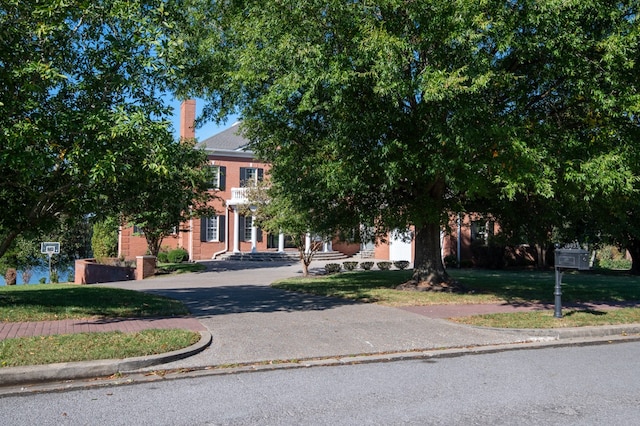 view of property hidden behind natural elements