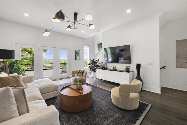 living room featuring french doors, a chandelier, and hardwood / wood-style floors