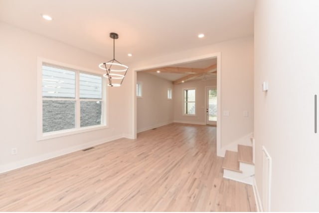 empty room featuring ceiling fan and light hardwood / wood-style floors