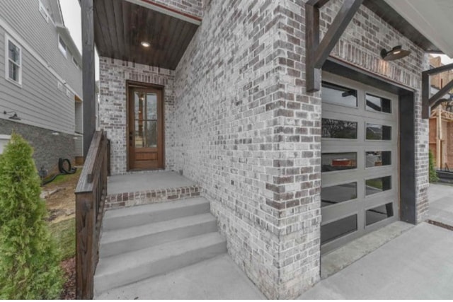 doorway to property featuring a garage