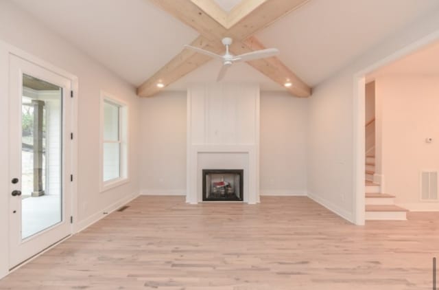 unfurnished living room featuring ceiling fan, vaulted ceiling with beams, and light hardwood / wood-style flooring