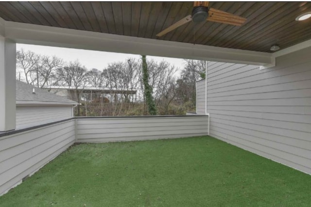 view of yard featuring ceiling fan