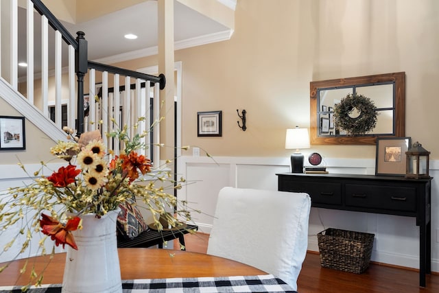 dining area featuring dark hardwood / wood-style floors and ornamental molding