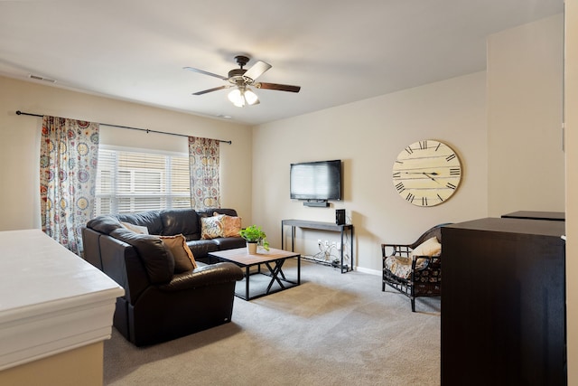 living room with ceiling fan and light colored carpet