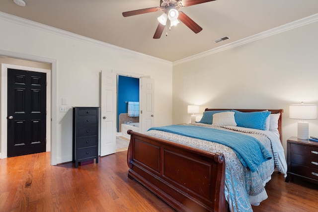 bedroom with dark wood-type flooring, ceiling fan, ornamental molding, and ensuite bath