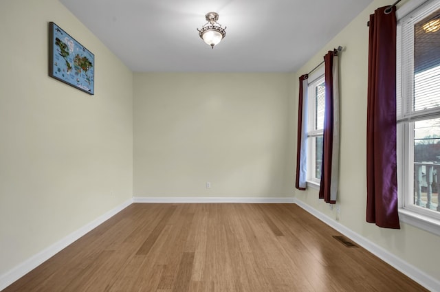 unfurnished room featuring light hardwood / wood-style flooring