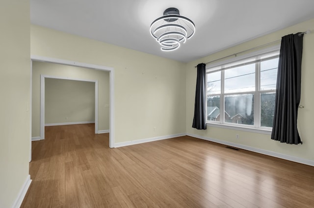 spare room featuring light hardwood / wood-style floors