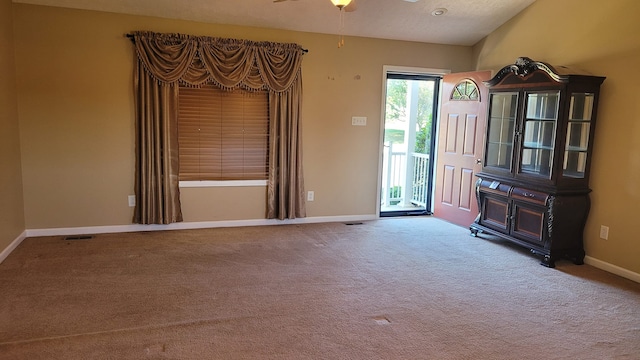 interior space featuring ceiling fan and a textured ceiling