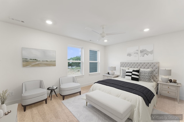 bedroom with light carpet and ceiling fan