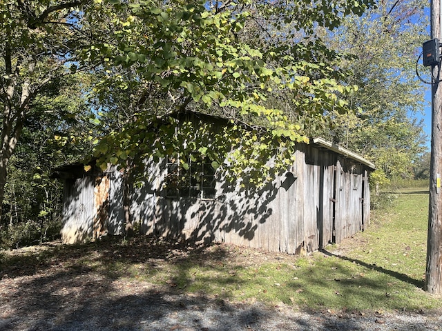 view of side of property with a yard