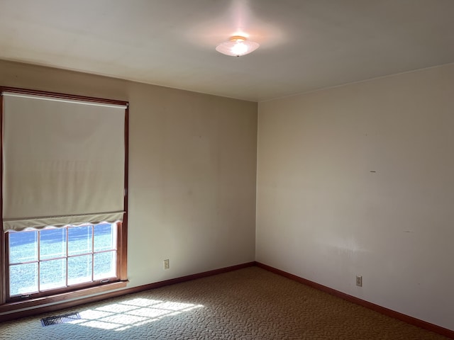 empty room featuring carpet flooring