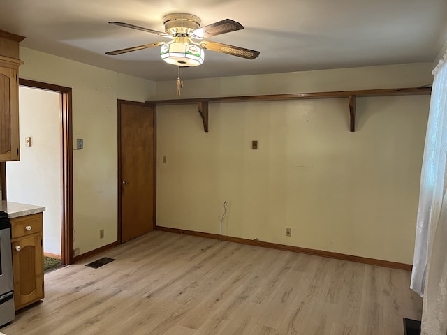 interior space with light wood-type flooring and ceiling fan