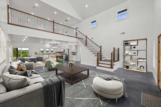 living room featuring high vaulted ceiling