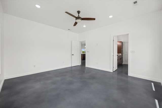 unfurnished bedroom with ceiling fan and connected bathroom