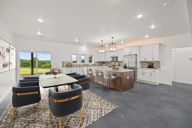 dining space featuring a notable chandelier