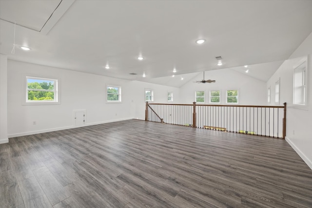 unfurnished room with ceiling fan, lofted ceiling, dark hardwood / wood-style flooring, and a wealth of natural light