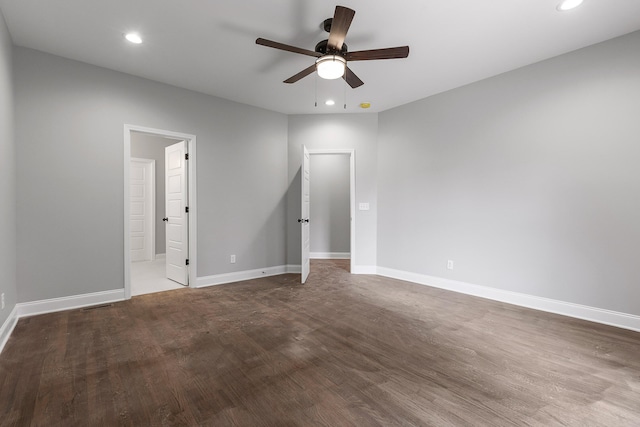 unfurnished bedroom with ceiling fan, connected bathroom, and wood-type flooring