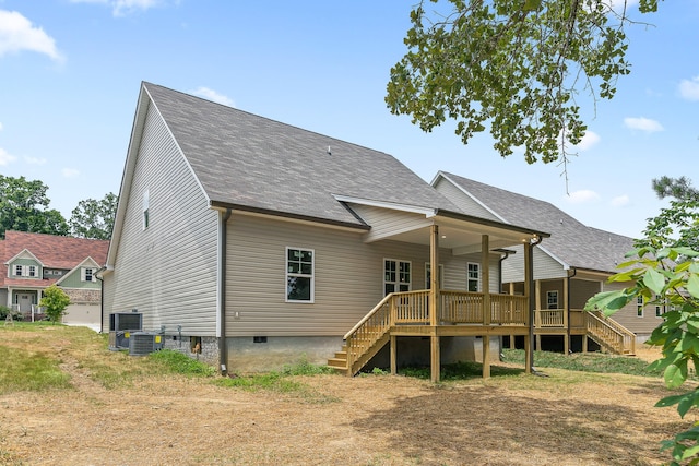 rear view of property with a wooden deck