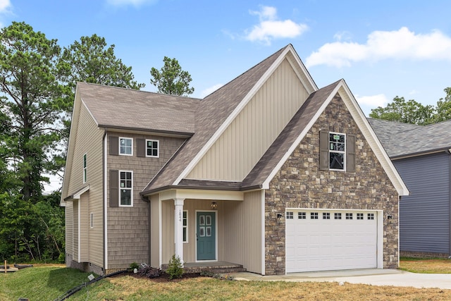 view of front of home featuring a front yard and a garage